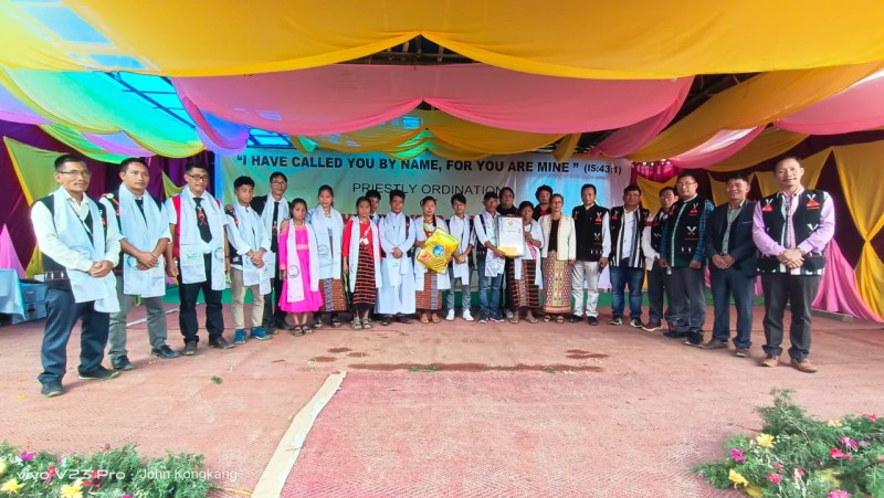 Newly ordained Priest with others